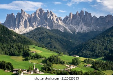 The great rocky walls of the Odle Dolomites Group above the village of Santa Maddalena in Val di Funes.