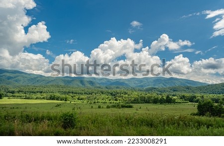 Great smokey mountain national park green field overlook with clouds on a summer day