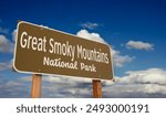 Great Smoky Mountains National Park Road Sign (Tennessee, North Carolina) Against Blue Sky and Clouds.