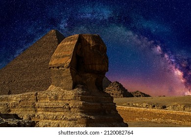 Great Sphinx of Giza with Pyramid of Khafre on background guarding the tombs of the pharaohs at night under the Milky Way galaxy. Cairo, Egypt