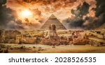 Great sphinx and pyramid and storm clouds