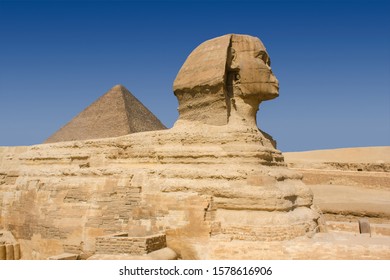 Great Sphynx And Pyramid Of Khufu Or Cheops On Plateau Giza, Near Cairo, Egypt.