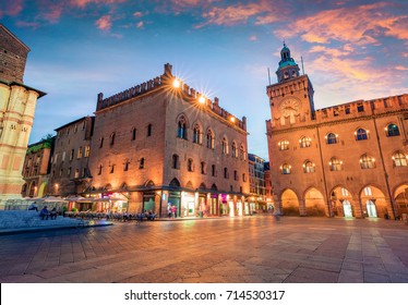 Great spring sunset of the main square of City of Bologna with Palazzo d'Accursio and facade of Basilica di San Petronio. Great cityscape of Bologna, Italy, Europe. Traveling concept background.