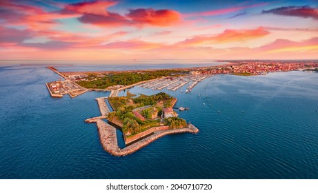 Great sunset on Adriatic sea. Stunning summer view from flying drone of San Felice fortress, Italy, Europe. Traveling concept background.