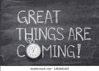 great things are coming phrase written on chalkboard with vintage precise stopwatch