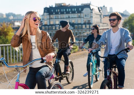 Similar – Image, Stock Photo A row of bicycles, behind them greenhouses, behind them the typical narrow buildings of downtown Amsterdam