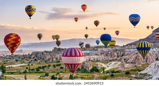 The great tourist attraction of Cappadocia - balloon flight. Cappadocia is known around the world as one of the best places to fly with hot air balloons. Goreme, Cappadocia, Turkey - Powered by Shutterstock