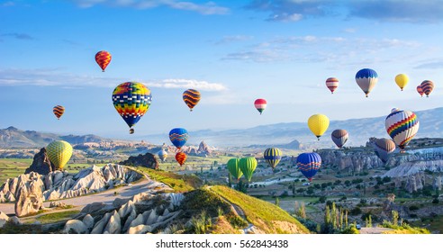 The great tourist attraction of Cappadocia - balloon flight. Cappadocia is known around the world as one of the best places to fly with hot air balloons. Goreme, Cappadocia, Turkey - Shutterstock ID 562843438