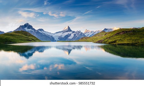 Great view of the snow rocky massif. Popular tourist attraction. Dramatic and picturesque scene. Location place Bachalpsee in Swiss alps, Grindelwald valley, Bernese Oberland, Europe. Beauty world. - Shutterstock ID 585551732