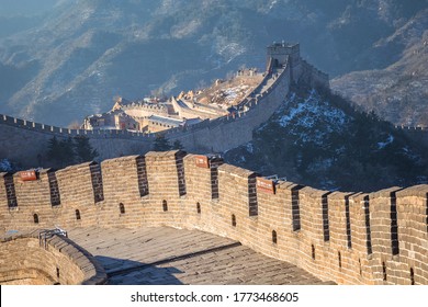 The Great wall of China at Badaling site in Beijing, China (Chinese language translations are on the same plates that hung on the wall)