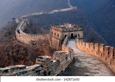 Great Wall sunset over mountains in Beijing, China.