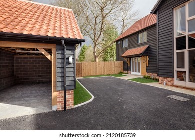 Great Wilbraham, Cambridgeshire, England - Feb 24 2017: Brand New Home With Driveway And Garage With Black Painted Shiplap Timber Cladding