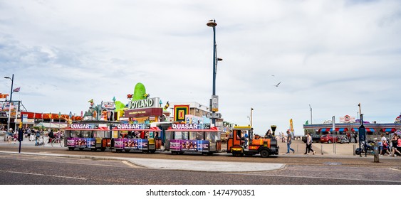 Great Yarmouth, Norfolk, UK – June 01 2019. The Small Train Waiting For Tourists To Embark For A Ride Up The Golden Mile In Great Yarmouth.