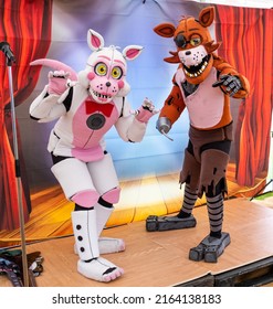 Great Yarmouth, Norfolk, UK – June 04 2022. Two People Dressed Up In Cosplay As Fictional Anime Fox And Cat Characters At The 2022 Comicon Event