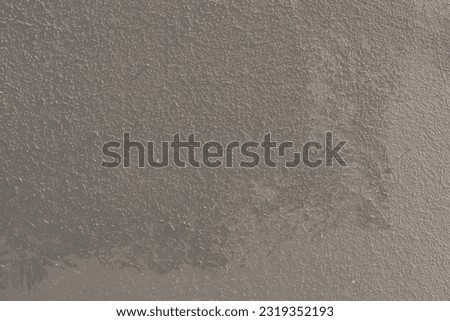 greay grunge plaster wall background with sunlight