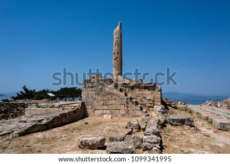 Greece, Aegina: Ruin of famous Temple of Apollo with sun, collumn and blue sky - concept history travel. The patron of Delphi, Apollo was an oracular god, the prophetic deity of the Delphic Oracle.