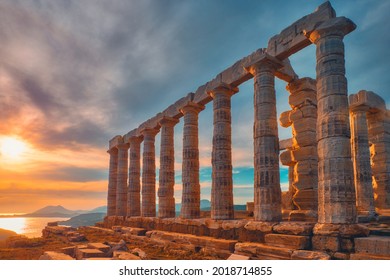 Greece Cape Sounio. Ruins of an ancient temple of Poseidon, Greek god of the sea, on sunset. Shot of temple ruins on sunset. Tourist landmark of Attica, Sounion, Greece - Shutterstock ID 2018714855