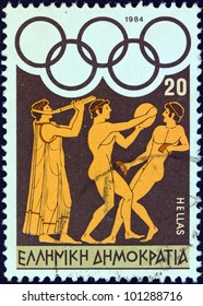 GREECE - CIRCA 1984: A stamp printed in Greece from the "Olympic Games, Los Angeles" issue shows flute player, discus thrower and long jumper, circa 1984.