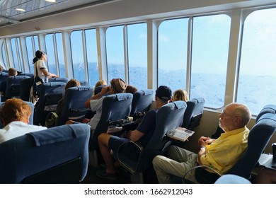 Greece, Crete. 11-09-2019. Passengers sitting in cabin of Greek ferry SeaJets, trip Heraklion Port Desk Santorini Cruise