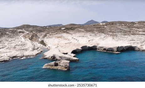 Greece. Drone view of a body of water showcasing elements such as mountains and coastal landforms. The scene reflects the beauty of nature in a winter setting. - Powered by Shutterstock