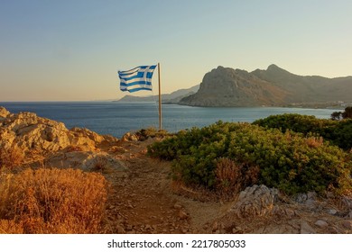 greece flag on the coast at mediterranean sea on rhodes island - Shutterstock ID 2217805033