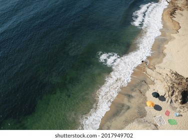 Greece, July 2021. Nice Sea View.  Photo Taken With A Drone In The Beach With Umbrellas And Waves. No People