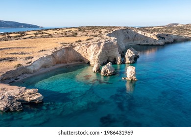 Greece, small Cyclades islands. Kato Koufonisi secluded beaches aerial drone view. Rocky cliffs over clear turquise sea water. Sunny day, tranquil summer vacation destination