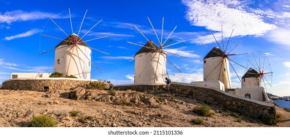 Greece travel, windmills of Mykonos island. Chora town, popular touristic attraction. Cyclades - Shutterstock ID 2115101336