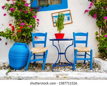 Greece: Typical Greek Blue Chairs and Table in a small Cafeteria 