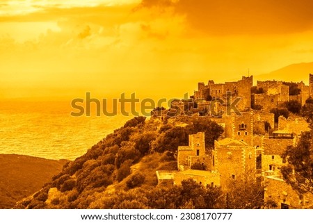 Greece Vatheia village at sunset. Old abandoned tower houses in Vathia Mani Peninsula in evening time. Laconia Peloponnese, Europe.