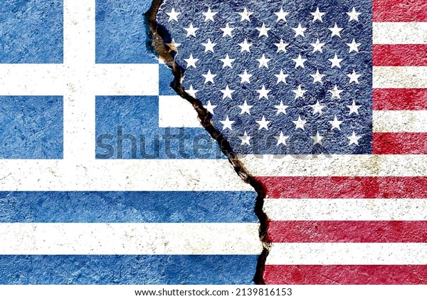 Greece vs USA national flags isolated on\
weathered cracked wall background, abstract Greece US politics\
economy relationship friendship divided conflicts concept texture\
wallpaper