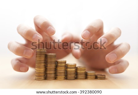 Greed for money. Hands grabbing coins. 