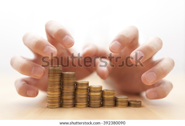 Greed for money. Hands\
grabbing coins. 