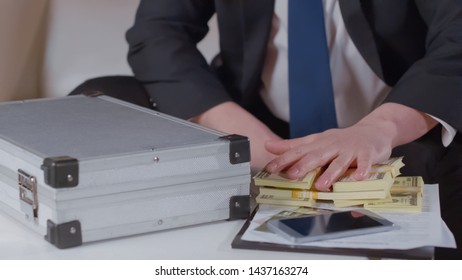 Greedy Hand Holding Money On Table, Concept Of Bribery In Government, Business