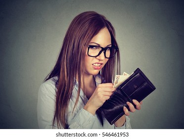 Greedy Young Woman Counting Taking Out Money From Her Wallet 