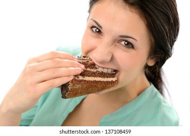 Greedy Young Woman Eating Tasty Cake Looking At Camera