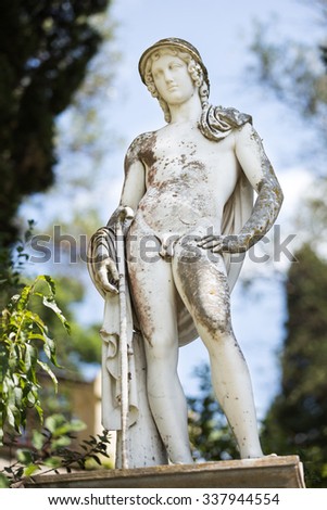 Greek ancient statue in front of a Achillion palace, Greece.