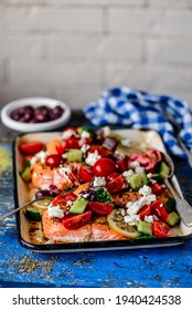 Greek Baked Salmon With Greek Salad.style Rustic.selective Focus