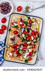 Greek Baked Salmon With Greek Salad.style Rustic.selective Focus