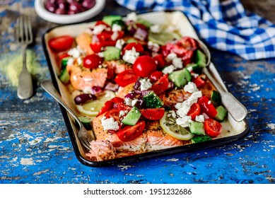 Greek Baked Salmon With Greek Salad.style Rustic.selective Focus