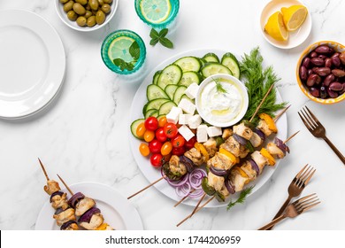 Greek Chicken Party Skewers Served With Tzatziki And Fresh Vegetables, Top Down View Of Party Table Setting