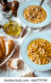 Greek Chickpea Soup In The White Wooden Table Vertical