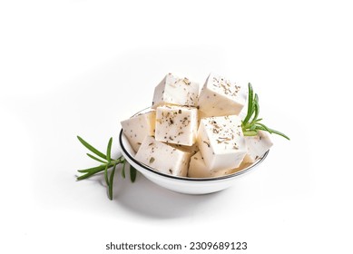 Greek Feta Cheese isolated on white background, top view. Fresh Feta cheese seasoning with herbs.