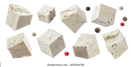 Greek feta cubes with herbs and spices, diced soft cheese isolated on white background with clipping path, collection