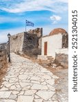 Greek flag waving in Kastellorizo ​​castle, Kastellorizo ​​island, Dodekanisos, Greece