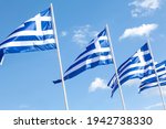 Greek flags waving in Syntagma Square, Athens, Greece, during the preparations for the celebration for the 200 years of the Greek Independence Day (25.03.1821-25.03.2021).