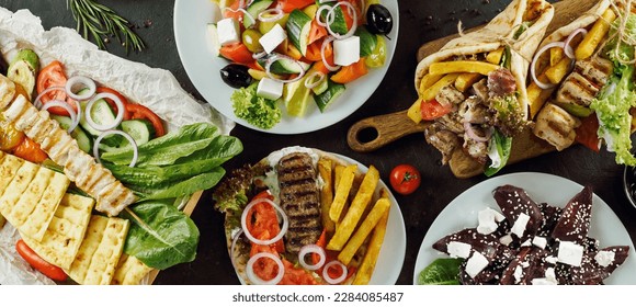 Greek food assorted on dark background, long horizontal banner. Gyros, greek salad, souvlaki - selected of greek cuisine assortment - Shutterstock ID 2284085487