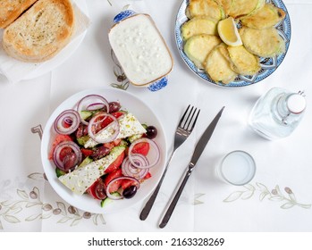 Greek Food Background. Ouzo, Greek Salad, Tzatziki, Assortment Of Feta. Top View. Traditional Greek Taverna Menu. Close Up