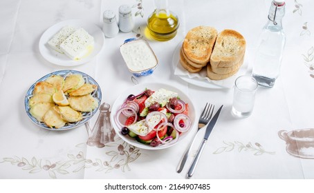 Greek Food Background. Ouzo, Greek Salad, Tzatziki, Assortment Of Feta. Top View. Traditional Greek Taverna Menu. Close Up