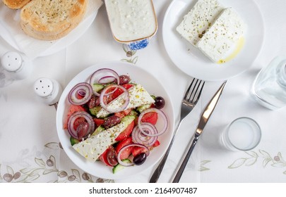 Greek Food Background. Ouzo, Greek Salad, Tzatziki, Assortment Of Feta. Top View. Traditional Greek Taverna Menu. Close Up